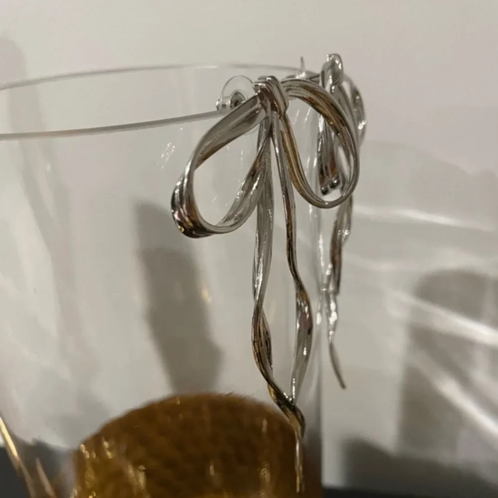 Anthro Silver Bow Earring